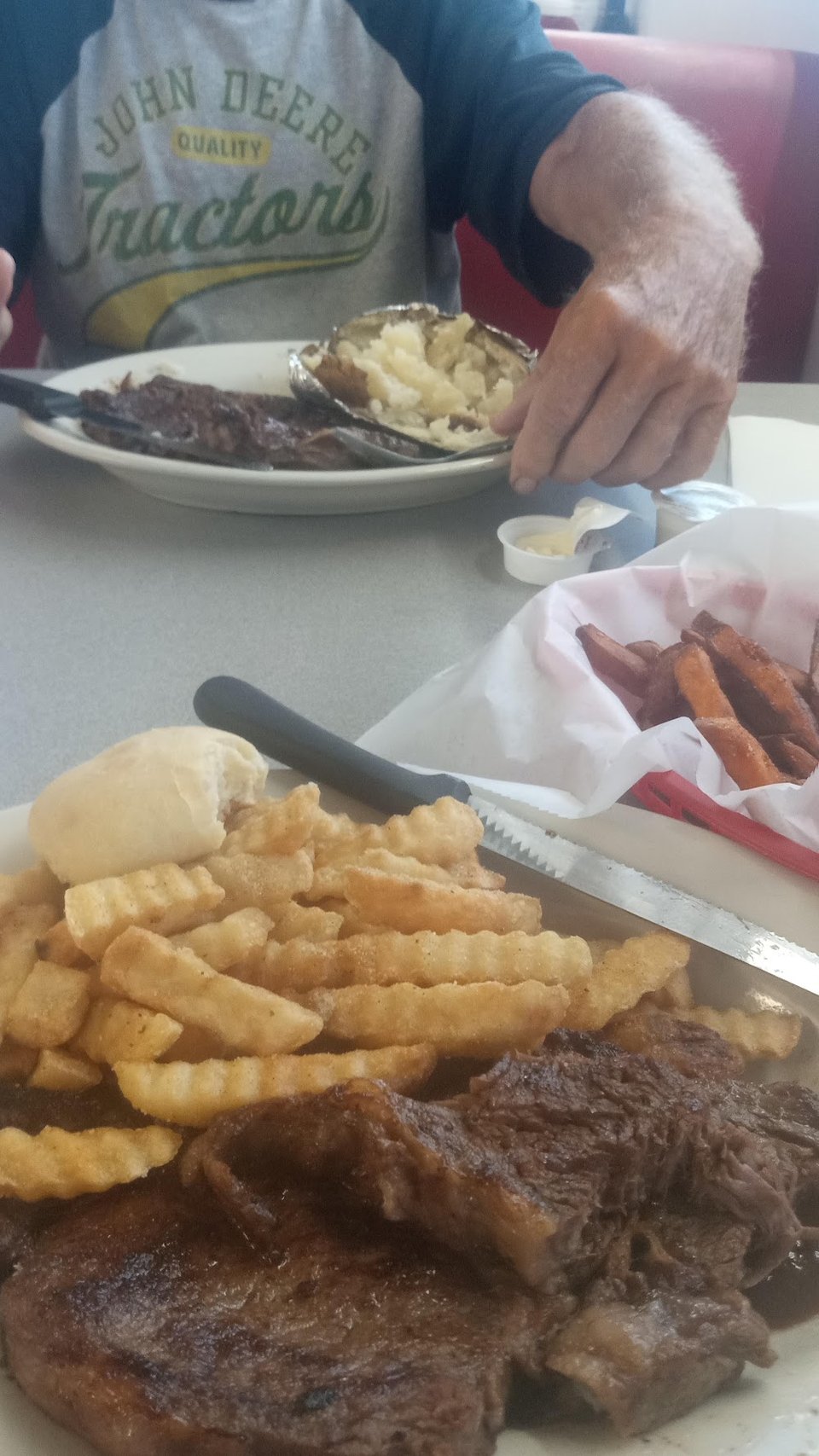 Restaurant menu featuring salads and fried sides.
