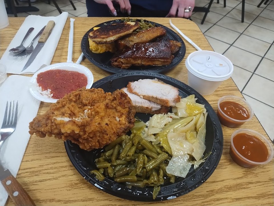 Restaurant menu featuring salads and fried sides.