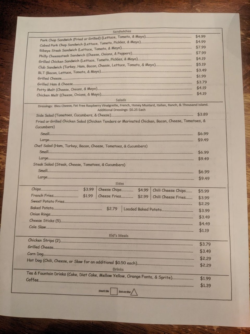 Printed menu with chicken strips and fries.